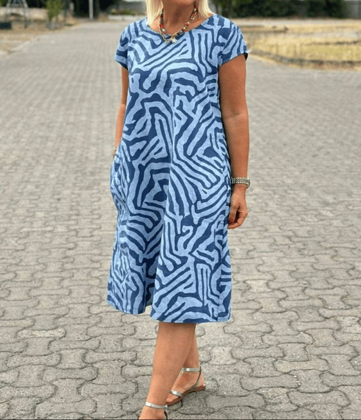 Solinaprint | Kleid mit Rundhalsausschnitt und Wunderschönem, Bauchbedeckendem Print