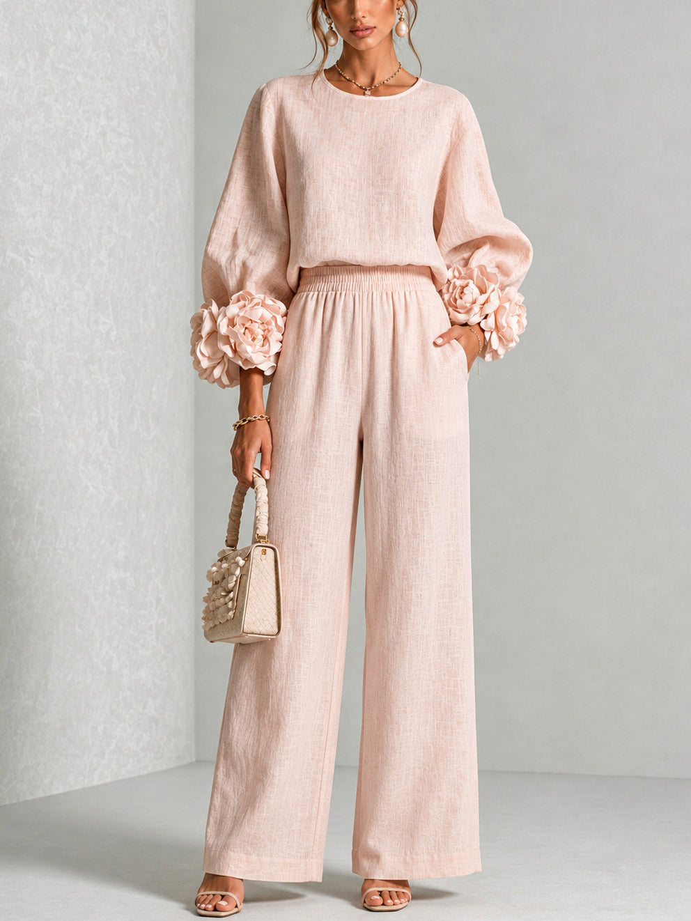 Rosalie Zweiteiler in Rosa mit Blüten-Manschetten und weiter Hose