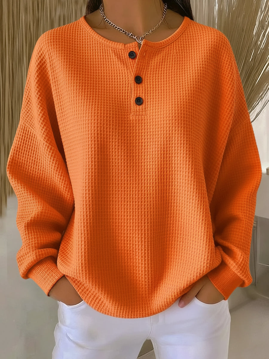 Mirabel Sweatshirt mit Henley-Ausschnitt in Orange